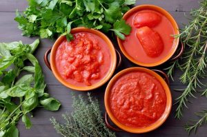 How is tomato paste made commercially